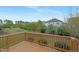Elevated deck showcasing a lush backyard view with mature trees and well-maintained landscaping at 844 Cozy Oak Ave, Cary, NC 27519