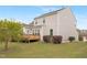 Two story house with a well-maintained backyard featuring a wooden deck and manicured landscaping at 844 Cozy Oak Ave, Cary, NC 27519