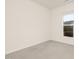 A clean, empty bedroom with plush carpeting and lots of natural light at 844 Cozy Oak Ave, Cary, NC 27519