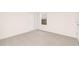 Empty bedroom features neutral carpeting, a window, and fresh paint at 844 Cozy Oak Ave, Cary, NC 27519
