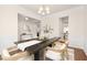 Spacious dining area with hardwood floors, modern decor, and an open layout design at 844 Cozy Oak Ave, Cary, NC 27519