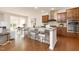 Modern kitchen featuring stainless steel appliances, granite countertops, and a breakfast bar at 844 Cozy Oak Ave, Cary, NC 27519