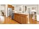 Charming kitchen island complemented by stainless steel appliances and plenty of cabinets at 844 Cozy Oak Ave, Cary, NC 27519