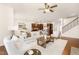 Open-concept living room flows seamlessly into the kitchen, featuring hardwood floors and neutral decor at 844 Cozy Oak Ave, Cary, NC 27519