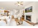 Bright and inviting living room with a fireplace, hardwood floors, and an open layout at 844 Cozy Oak Ave, Cary, NC 27519