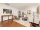 Cozy living room with hardwood floors, stylish furniture, and lots of natural light at 844 Cozy Oak Ave, Cary, NC 27519