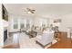 Spacious living room with fireplace, large windows, hardwood floors, and an open layout at 844 Cozy Oak Ave, Cary, NC 27519
