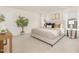 Relaxing main bedroom featuring a soft bed, neutral tones, and natural light from large windows at 844 Cozy Oak Ave, Cary, NC 27519