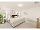 Bright main bedroom featuring neutral tones, plush carpet, and natural light at 844 Cozy Oak Ave, Cary, NC 27519