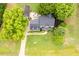 Landscaped property showing a home with an outdoor patio area, garden, and mature trees at 8517 Falkirk Ridge Ct, Wake Forest, NC 27587