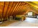 Spacious attic featuring wooden construction and a window for natural light at 8517 Falkirk Ridge Ct, Wake Forest, NC 27587