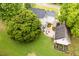 Backyard featuring an outdoor patio with seating and lush landscaping surrounding the property at 8517 Falkirk Ridge Ct, Wake Forest, NC 27587