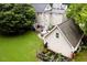 Exterior of a home with a backyard featuring an outdoor kitchen, patio, and vegetable garden at 8517 Falkirk Ridge Ct, Wake Forest, NC 27587