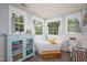 Bright bathroom with soaking tub, wooden floors, and modern blue dresser at 8517 Falkirk Ridge Ct, Wake Forest, NC 27587