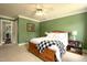Comfortable bedroom with wooden bed frame, ceiling fan and carpeted floor at 8517 Falkirk Ridge Ct, Wake Forest, NC 27587