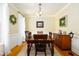 Formal dining room with hardwood floors, chandelier, and traditional furnishings at 8517 Falkirk Ridge Ct, Wake Forest, NC 27587