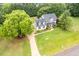 Beautiful two-story home with a well-maintained lawn, trees, and charming curb appeal at 8517 Falkirk Ridge Ct, Wake Forest, NC 27587