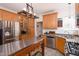 Bright kitchen features stainless steel appliances, an island, and light wood cabinetry at 8517 Falkirk Ridge Ct, Wake Forest, NC 27587