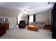 Spacious living room featuring carpeted floors, ceiling fan and lots of seating at 8517 Falkirk Ridge Ct, Wake Forest, NC 27587