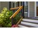 Close-up of a porch railing and potted plants, showcasing the home's curb appeal at 8517 Falkirk Ridge Ct, Wake Forest, NC 27587