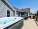 Backyard deck featuring a hot tub and an outdoor grill area at 90 Heathgreen Dr, Clayton, NC 27527