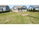 Expansive backyard with a water feature, a deck, and mature landscaping at 90 Heathgreen Dr, Clayton, NC 27527