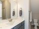 Clean bathroom with modern sink, grey cabinetry, and neutral wall colors at 90 Heathgreen Dr, Clayton, NC 27527