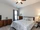 Comfortable bedroom with neutral colors, patterned bedding, and plenty of natural light at 90 Heathgreen Dr, Clayton, NC 27527