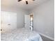Cozy bedroom with ceiling fan, closet doors and exterior door to a balcony at 90 Heathgreen Dr, Clayton, NC 27527