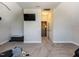 Spacious bonus room with mounted TV and ample carpeted floor space at 90 Heathgreen Dr, Clayton, NC 27527