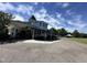 Charming clubhouse with covered seating, lush landscaping, and parking at 90 Heathgreen Dr, Clayton, NC 27527