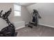 Private home gym with elliptical machine and multi-station workout equipment at 90 Heathgreen Dr, Clayton, NC 27527