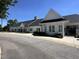 Well-maintained building with visible signage, landscaping, and parking at 90 Heathgreen Dr, Clayton, NC 27527