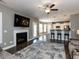 Bright and airy living room with fireplace adjacent to modern kitchen and breakfast bar at 90 Heathgreen Dr, Clayton, NC 27527