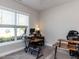 Well-lit office space featuring a work desk setup by a large window at 90 Heathgreen Dr, Clayton, NC 27527