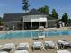 Inviting community pool with lounge chairs and a clear view of the clubhouse at 90 Heathgreen Dr, Clayton, NC 27527