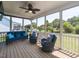 Inviting screened-in porch with comfortable seating and outdoor views at 90 Heathgreen Dr, Clayton, NC 27527