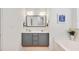 Bathroom featuring double sinks, vanity with drawers, and a framed mirror at 901 N Taylor St, Wake Forest, NC 27587