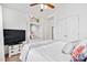 Cozy bedroom with a vaulted ceiling, closet, and built-in shelving with a small seating area at 901 N Taylor St, Wake Forest, NC 27587