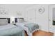 Bright bedroom with twin beds, closet and a large mirror at 901 N Taylor St, Wake Forest, NC 27587