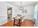 Formal dining room featuring a wood table, contemporary light fixture, and stylish decor at 901 N Taylor St, Wake Forest, NC 27587