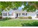 Charming single-story home with a well-manicured lawn and inviting front porch at 901 N Taylor St, Wake Forest, NC 27587