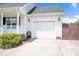 Attached two-car garage with a clean white door and concrete driveway at 901 N Taylor St, Wake Forest, NC 27587