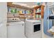 Functional laundry room equipped with modern appliances and ample storage space at 901 N Taylor St, Wake Forest, NC 27587