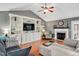 Inviting living room with a fireplace, built-in shelving, and hardwood flooring at 901 N Taylor St, Wake Forest, NC 27587