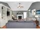 Bright living room with a cozy fireplace, vaulted ceiling, and a built-in entertainment center at 901 N Taylor St, Wake Forest, NC 27587