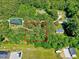 Elevated aerial photo with highlighted property lines, house nestled among mature trees at 9220 Old Cascade Dr, Garner, NC 27529