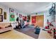 Finished basement space features an exercise area with weight equipment, dart board, and sports decor at 9220 Old Cascade Dr, Garner, NC 27529