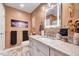 Stylish bathroom featuring granite counters, attractive color palate, and an illuminated vanity mirror at 9220 Old Cascade Dr, Garner, NC 27529
