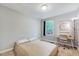 Simple bedroom featuring neutral decor, desk, carpet, and natural light at 9220 Old Cascade Dr, Garner, NC 27529